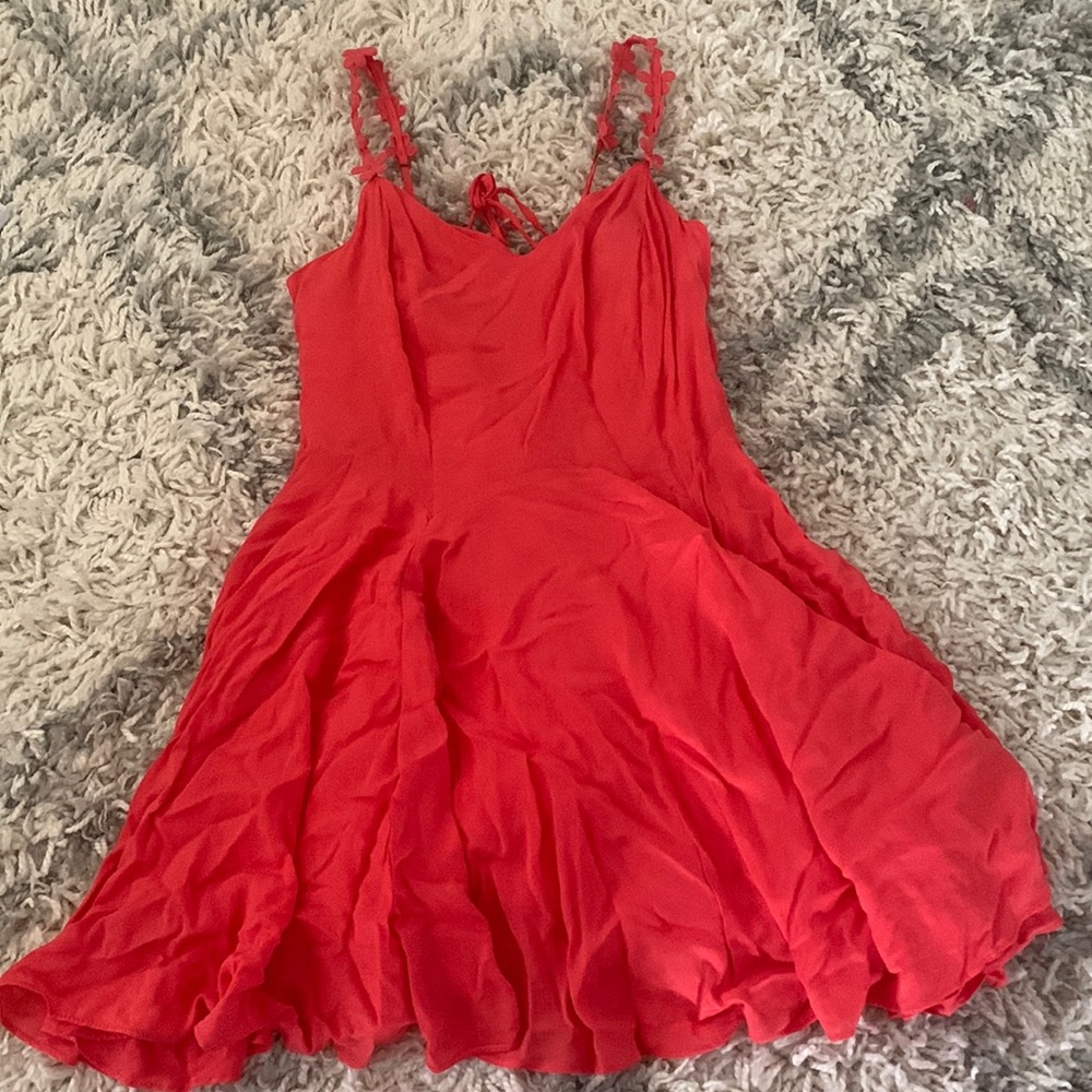 Coral mini dress with flowered straps
